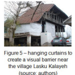 Figure 5 â€“ hanging curtains to create a visual barrier near the village Lasku Kalayeh (source: authors)